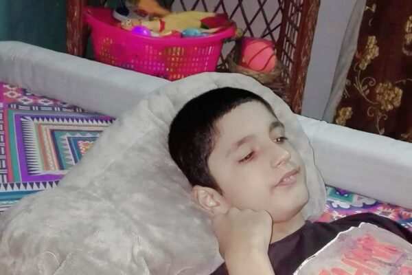 A boy lying on a bed