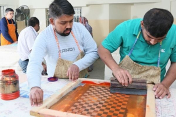 Person doing screen printing